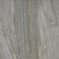 Piso porcelánico gris con vetas y textura tipo mármol, ideal para interiores elegantes.
